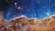 詹姆斯·韦伯太空望远镜拍摄的船底座星云中的“宇宙悬崖”图片